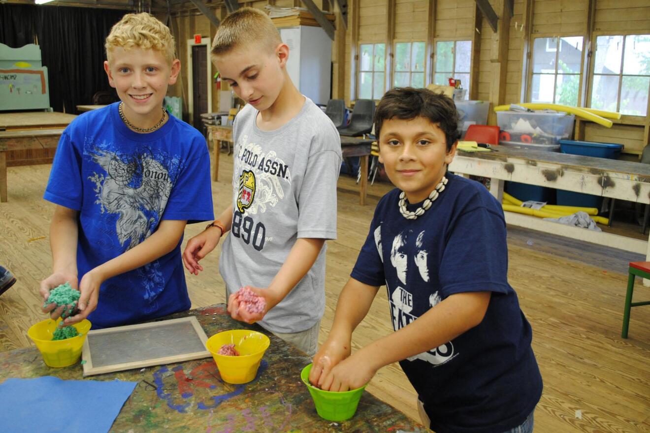 Jason Ray, Chris Dominique and Charlie Ray participate in a 2010 Operation Military Kids camp at Grant Walker Educational Center in Pollock.